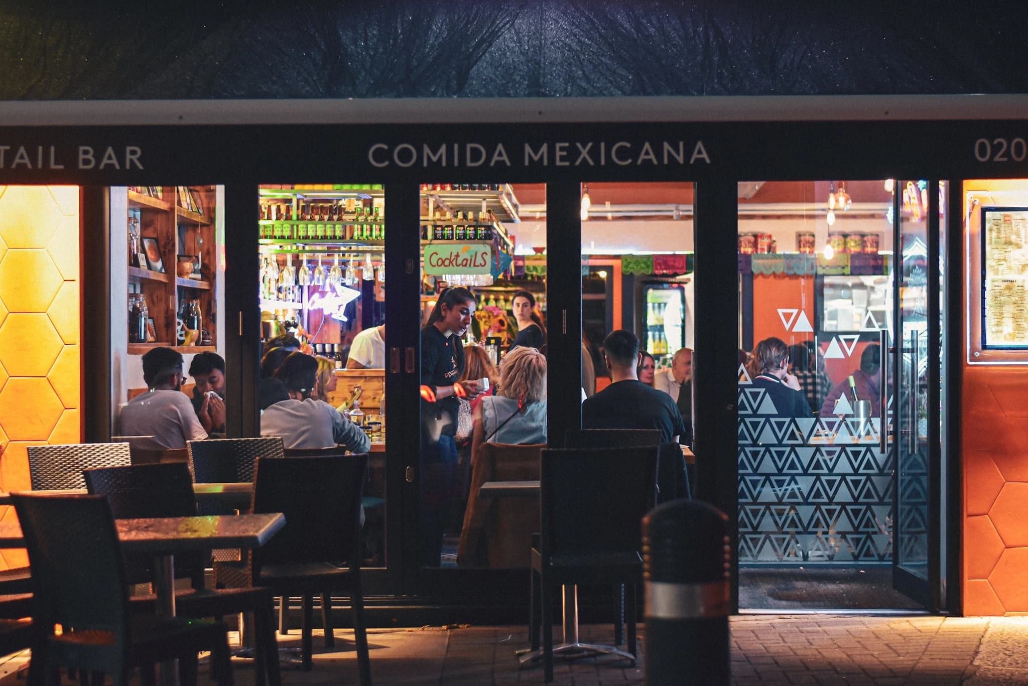 Taco Bros restaurant storefront at night